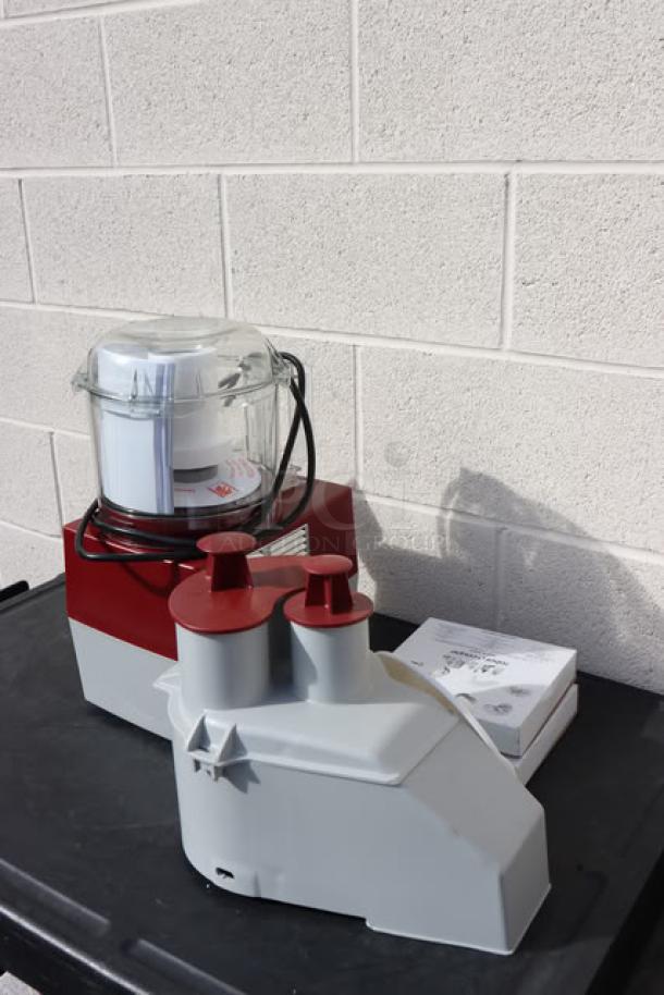Brand new Robot Coupe R2NCLR food processor with clear 3L bowl and continuous feed. 1 hp, includes two discs. Serial #2473543703S-11. Scratch-n-dent condition.