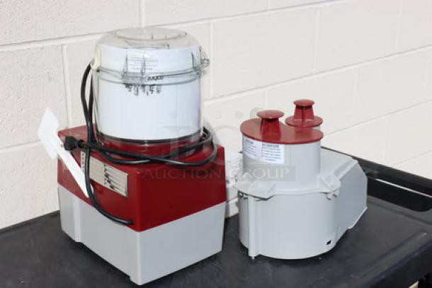 BRAND NEW Robot Coupe R2NCLR food processor with 3 qt clear bowl, continuous feed, 2 discs. Scratch-n-dent condition.