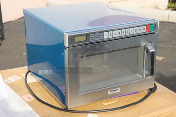 Brand new Panasonic NE-21523 stainless steel commercial microwave oven, 208/240V, 2100W, model NE-21523, S/N 6C33080025.