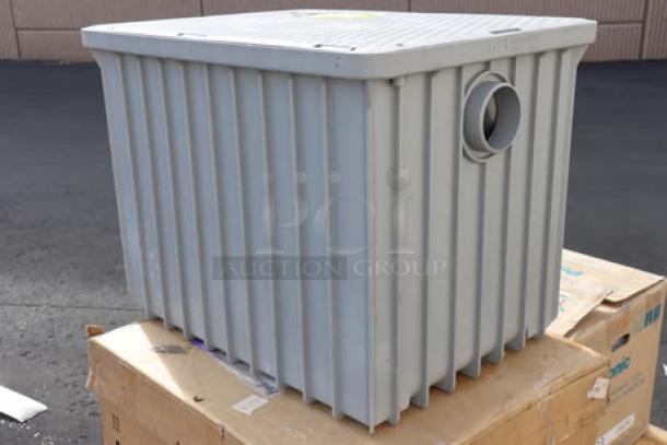 Endura 3950A04 100 lb. 50 GPM grease trap with 4" hub, new condition, no packaging, gray ribbed exterior.