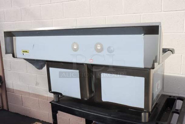 Regency 600S2171718R 57" stainless steel commercial sink, two 17" x 17" x 12" bowls, right drainboard, new condition.