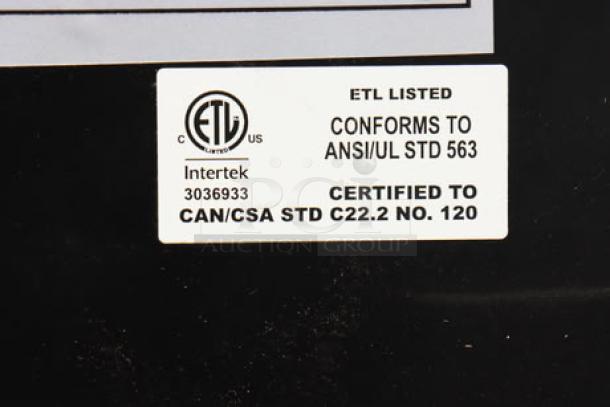 "ETL listed certification label on a Manitowoc air-cooled ice machine, model 3036933, conforms to ANSI/UL STD 563."