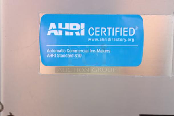 Manitowoc Air Cooled Ice Machine with AHRI certification label; brand new with minor dents.