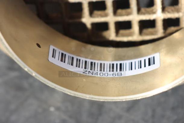 BRAND NEW Zurn Elkay ZN400-6B strainer, polished nickel bronze, 6" round, heel-proof square openings, barcode visible.