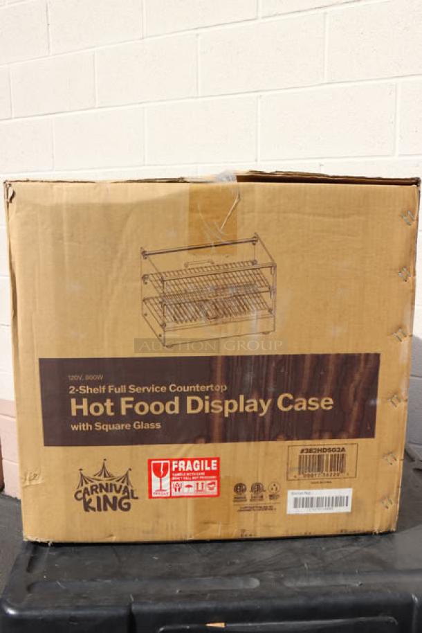 Carnival King HDCG2A hot food display case in damaged original packaging. Silver, curved glass, 2 shelves, 120V, 800W.
