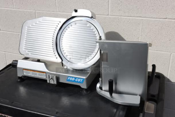 BRAND NEW ProCut KDS-12 12" Meat Slicer. 127V, 1/3 HP. Out of original packaging, may be missing small parts. S/N: H25-160064.