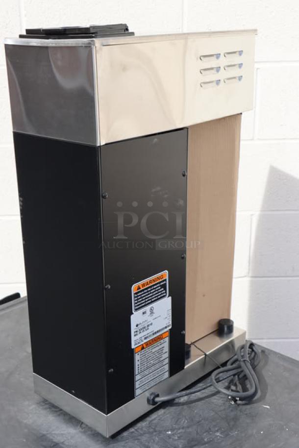 Brand new Bunn 33200.0010 VPR-APS pourover airpot coffee brewer, 120V, S/N: VPR1061791, with visible warning labels. Original packaging damaged.