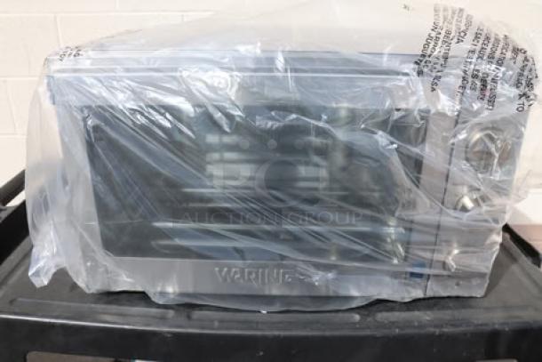 Brand new Waring WCO500X half-size convection oven, 1700W, 120V, in box. Packaging damaged but item is unused.