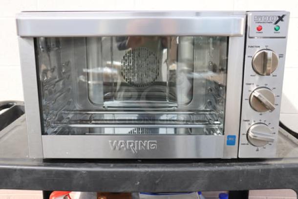 Brand new Waring WCO500X countertop convection oven, 120V, 1700W. Packaging damaged. Stainless steel finish.