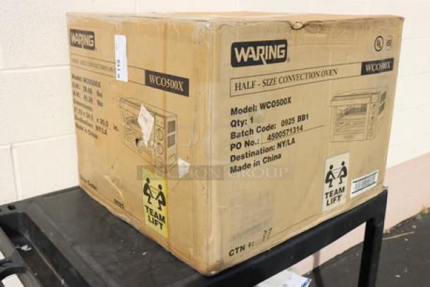 Waring WCO500X Half Size Countertop Convection Oven, 120V, 1700W, new in damaged box, model and shipping details visible.