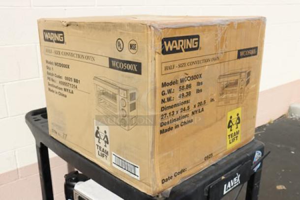 New Waring WCO500X half-size countertop convection oven in damaged box. Model, weight, and dimensions labeled.