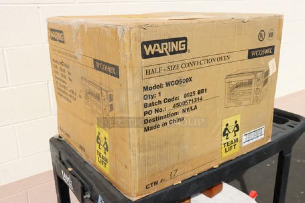 Waring WCO500X Half Size Countertop Convection Oven, 120V, 1700W, new in damaged box, model and batch details visible.