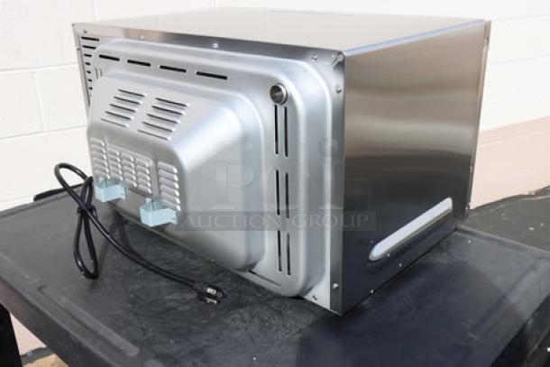 New Waring WCO500X half-size countertop convection oven, 120V, 1700W. Stainless steel exterior. Packaging damaged.