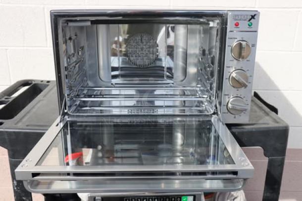 Brand new Waring WCO500X half-size countertop convection oven. Model WCO500X, 120V, 1700W. Packaging damaged.