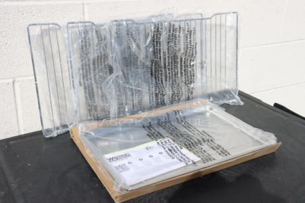 Waring WCO500X half-size convection oven components in packaging; box damaged. Includes racks, tray, and manual.
