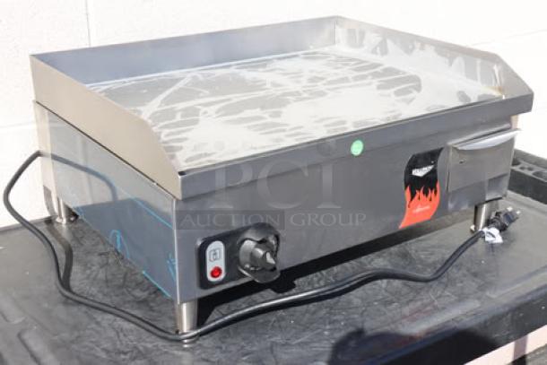 Brand new Vollrath 40716 Cayenne 24" electric griddle, thermostatic controls, minor dings, and scratches. Model and serial number visible.