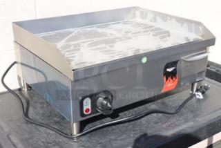 Brand new Vollrath 40716 Cayenne 24" electric griddle, thermostatic controls, minor dings, and scratches. Model and serial number visible.