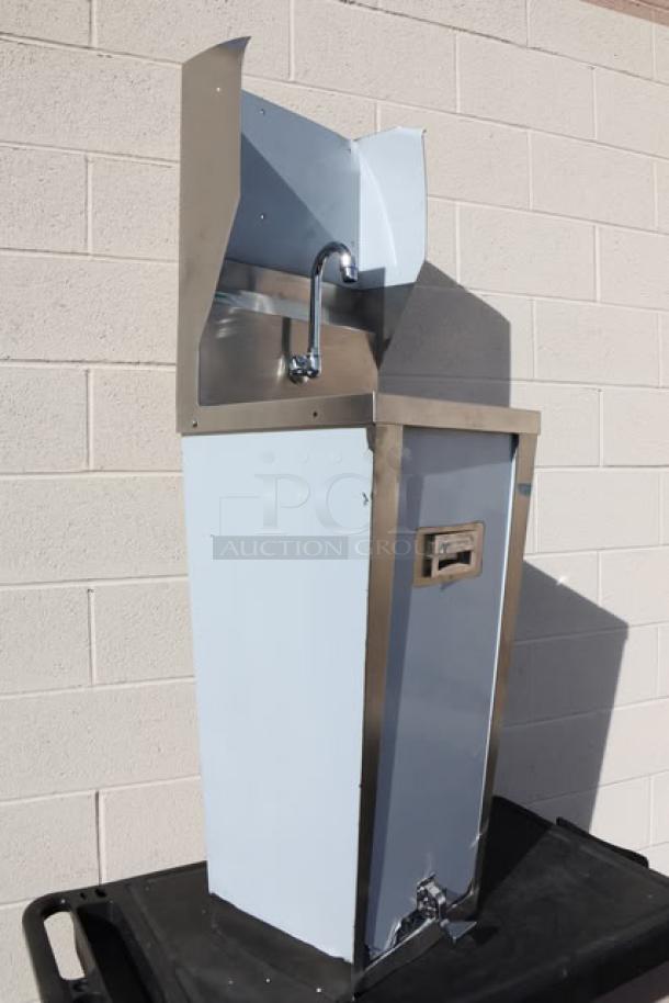 Brand new Regency 600HS17FPB 17"x15" hands-free hand sink with pedestal base, minor dents, stainless steel finish.