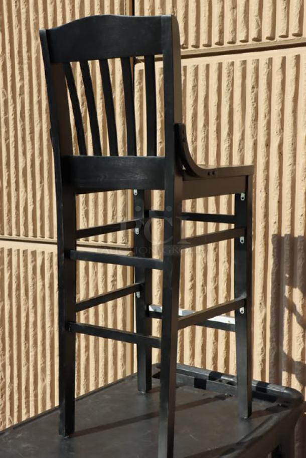 Lancaster Table & Seating bar height barstool, wood, new with minor scratches, black finish, slatted back design.