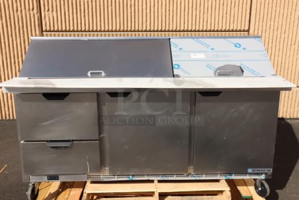 Beverage-Air SPED72HC-30M-2 refrigerated sandwich prep table, 72", 2 doors, 2 drawers, stainless steel, visible labels, on pallet.