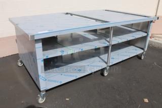 Domino's Pizza 8ft "CUTTING EDGE" table, brand new, bent middle, damaged brackets, center shelf, on commercial casters.