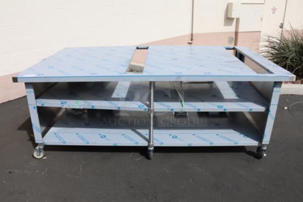 BRAND NEW Duke Domino's Pizza 8ft "CUTTING EDGE" table, bent center, damaged brackets, center shelf, storage, on casters.