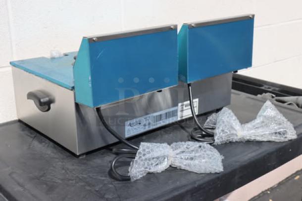 Brand new Avantco F102 20 lb. Dual Tank Electric Countertop Fryer, 120V, 3500W. Out of original packaging.