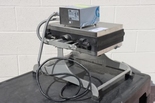 Krampouz WECCBEAT Brussels style swivel waffle maker, 4" x 6", 208V, 2600W, new condition, out of packaging.