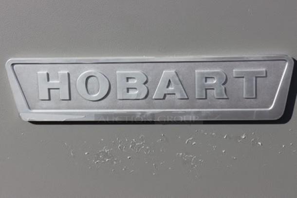 Hobart Legacy+ HL200-10STD planetary mixer in near perfect condition, minor scratches and dents, model plaque visible.