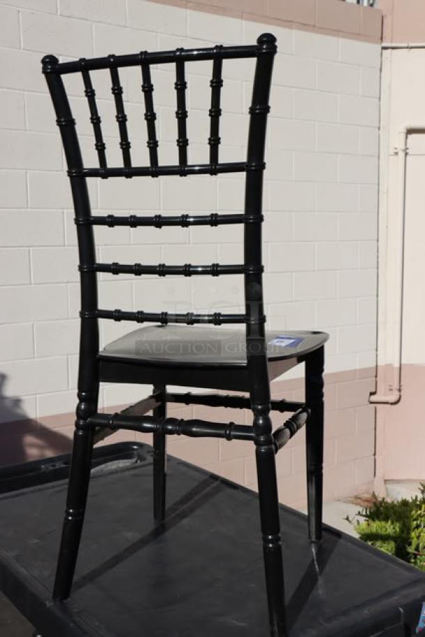 Brand new Lancaster Table & Seating Black Resin Chiavari Chair, no packaging, classic design, sturdy resin construction.