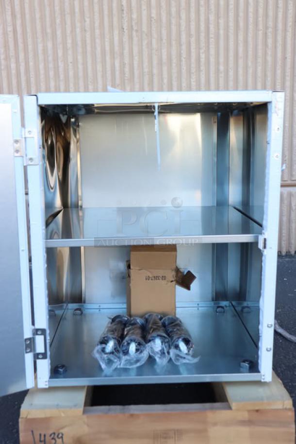 Scotsman HST21-A stainless steel ice dispenser stand, new with a dent on top back right. Includes door, serial no. 24101320015262.