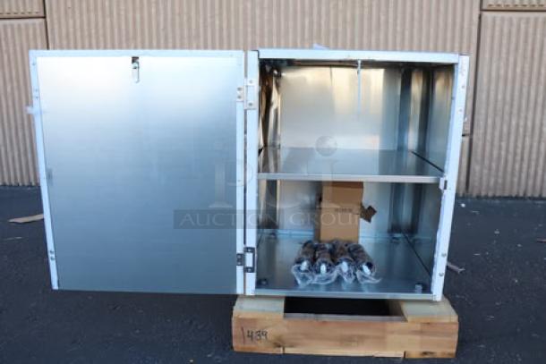 Brand new Scotsman HST21-A stainless steel ice dispenser stand with door. Features dent on the top back right side.