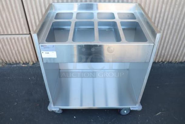 ServIt 32" stainless steel flatware/tray cart, model TSC-32, with 8 pan capacity; minor scratches and dents, no packaging.