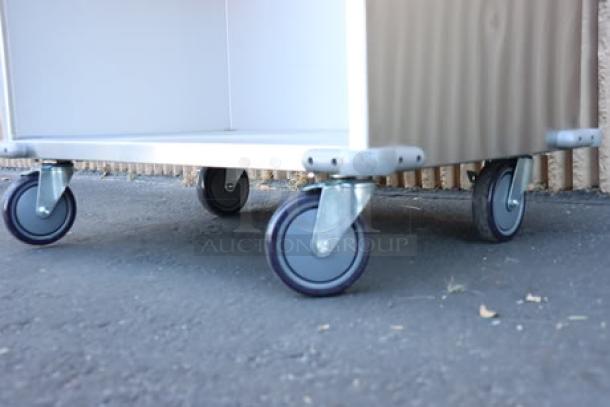 ServIt 32" Stainless Steel Flatware/Tray Cart, Model TSC-32, 8 pan capacity, minor scratches and dents, on casters.