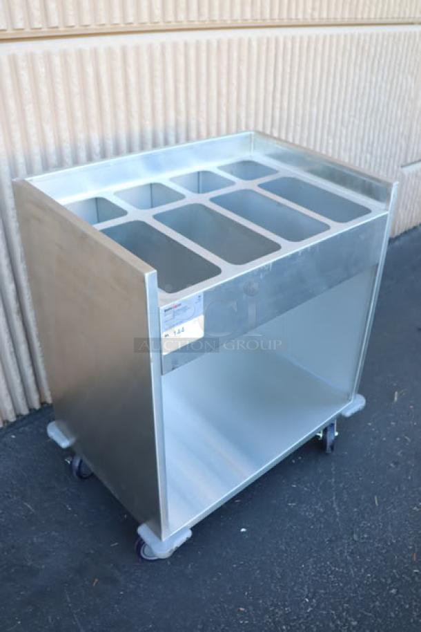 Brand new ServIt 32" stainless steel flatware/tray cart TSC-32 with 8 pan capacity. Minor scratches and dents on right side and back.