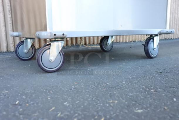 ServIt 32" stainless steel flatware/tray cart, model TSC-32, with 8 pan capacity. Minor scratches and dents on right side.