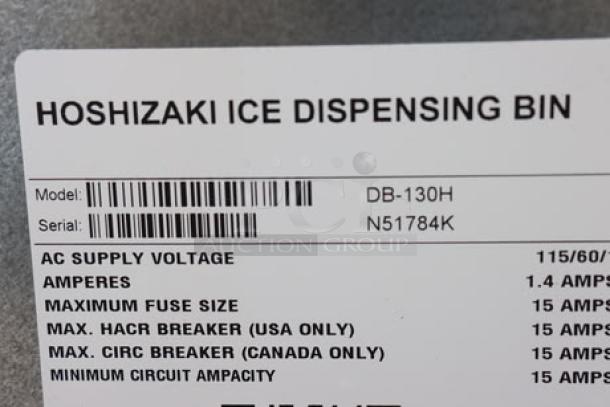 Hoshizaki DB-130H ice dispenser tag showing model, serial number, voltage, and amp details; minor scratches visible.
