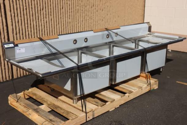 Regency 124" stainless steel three-compartment commercial sink with 2 drainboards; model 600S32424218; bent back right leg socket.