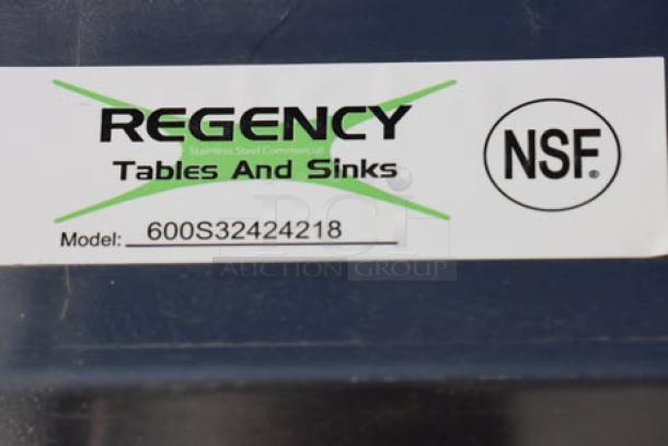 Regency 124" 16-gauge stainless steel three-compartment sink with 2 drainboards, model 600S32424218; NSF label visible.