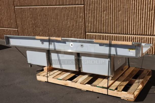 Brand new Regency 124" 16-gauge stainless steel 3-compartment sink with 2 drainboards, Model 600S32424218. Back right leg socket bent.