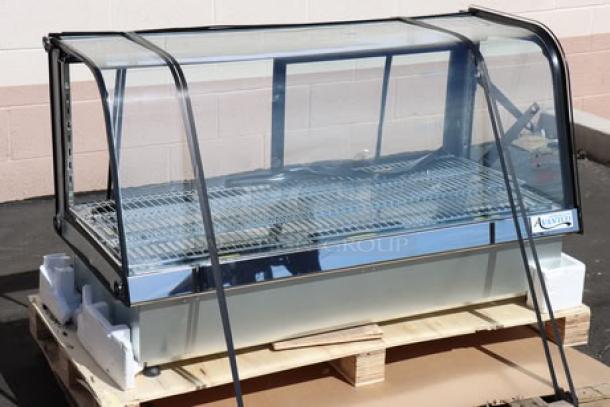 Brand new Avantco BCDI-48 curved refrigerated bakery display case, black frame, 48", 115V, on pallet, minor dents.