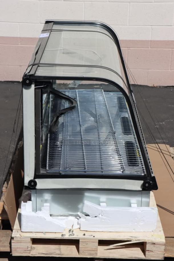 Avantco BCDI-48 bakery display case, 48", black, curved, refrigerated, scratch-n-dent, 115V, on wooden pallet.