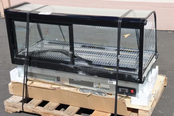 Avantco BCDI-48 refrigerated bakery display case, 48", black, curved glass, new scratch-n-dent, 115V, on pallet.