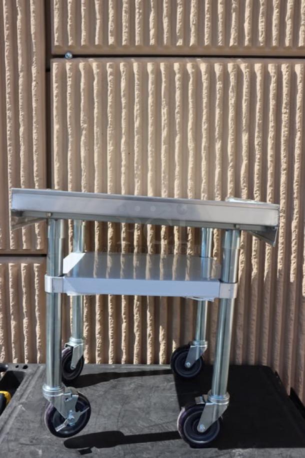 Regency 600ES2424GK 24" x 24" stainless steel equipment stand with galvanized undershelf, casters; minor scratches.