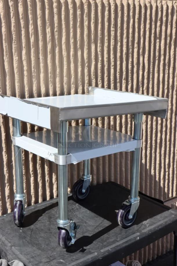Regency 600ES2424GK 24"x24" stainless steel stand with galvanized undershelf and casters, new with minor scratches.