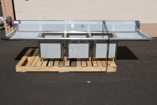 Regency 600S31824224 106" stainless steel commercial sink, three compartments, two 24" drainboards, new with dents.