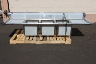 Regency 600S31824224 106" stainless steel commercial sink, three compartments, two 24" drainboards, new with dents.