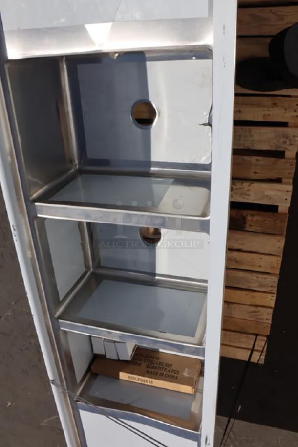 Regency three-compartment stainless steel sink, model 600S31824224, 16 gauge, with two 24" drainboards. Scratch and dent condition.