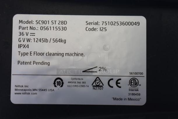 Advance SC901 ST 28D floor scrubber label showing model, serial number, IPX4 rating, and manufacturing details.