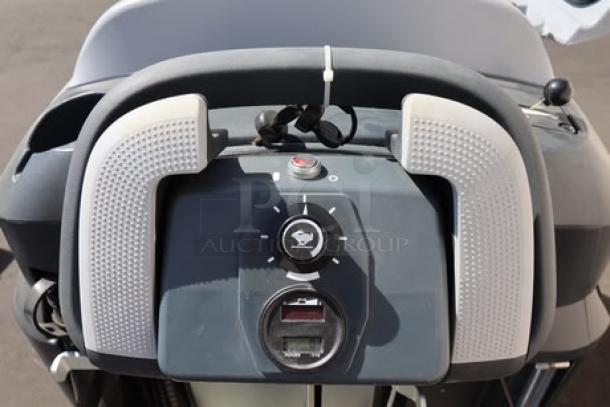 Advance SC901 ST 28D floor scrubber controls, 28" cleaning path, new condition. Features include buttons and grip handle.